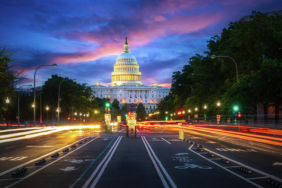 Capital building in Washington DC city at night wiht street and  Photograph by Anek Suwannaphoom