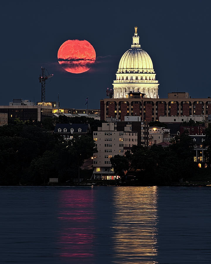 Capitol Lunacy -  full moon rising beside WI Capitol dome from Peninsula Point Photograph by Peter Herman