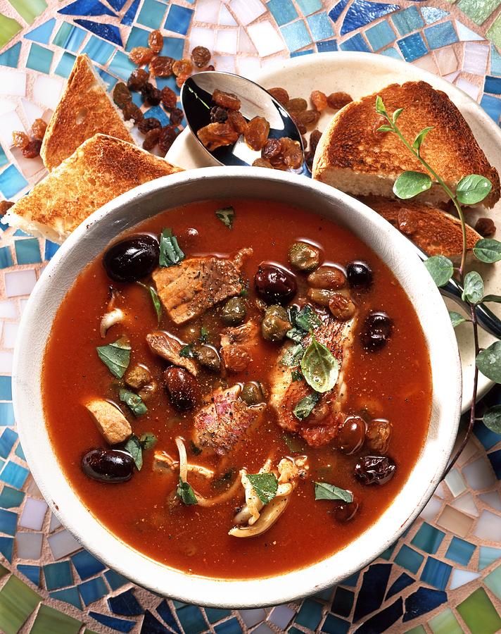 Capperata Siciliana fish Soup With Tomatoes And Olives, Italy Photograph by Franco Pizzochero
