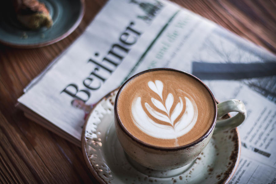 Cappuccino With Latte Art On A Newspaper Photograph by Mel Boehme