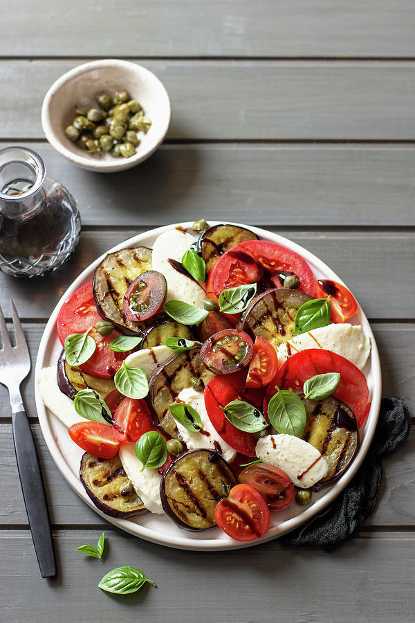Caprese Salad With Grilled Aubergine Slices And Capers Photograph by Zuzanna Ploch