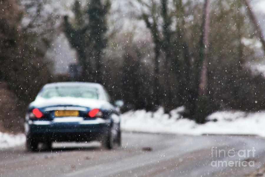 Car Driving In Snowy Conditions Photograph by Stephen Burt/science Photo Library