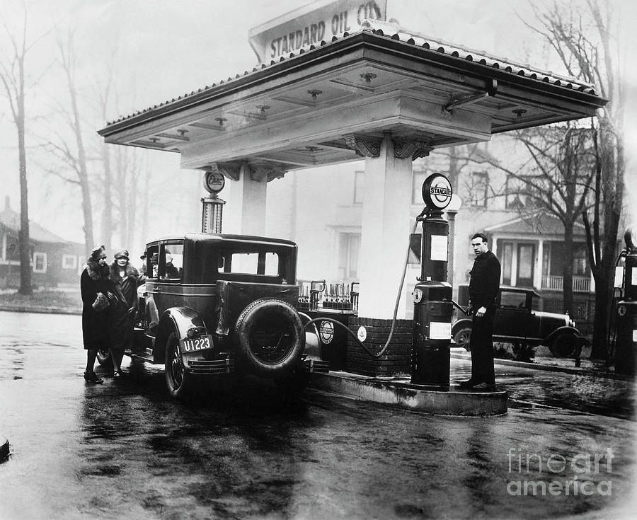 Car Fueling Up At Gas Station Photograph by Bettmann