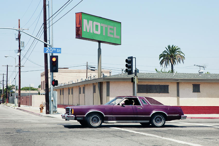 Car Passing Motel In Los Angeles Photograph by Michael Wells