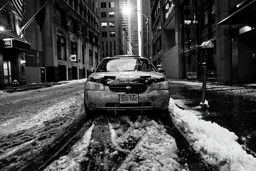  Car with ice and snow parked on the street. Photograph by Joaquin Corbalan