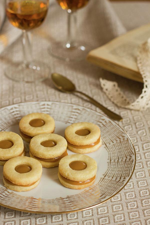 Caramel Biscuits And Dessert Wine Photograph by Alice Del Re