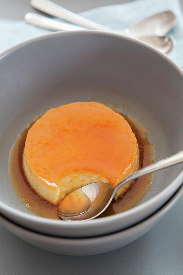 Caramel Cream In A Bowl With A Spoon Photograph by Jan Wischnewski
