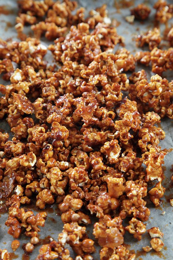 Caramel Popcorn On A Baking Tray Photograph by Danya Weiner