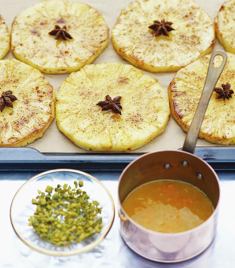 Caramelised Pineapple Slices With Orange Syrup, Cardamom And Pistachios Photograph by Nele Braas