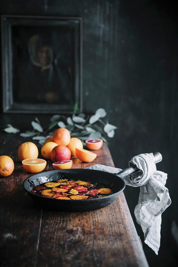 Caramelized Blood Oranges In An Iron Pan Photograph by Justina Ramanauskiene