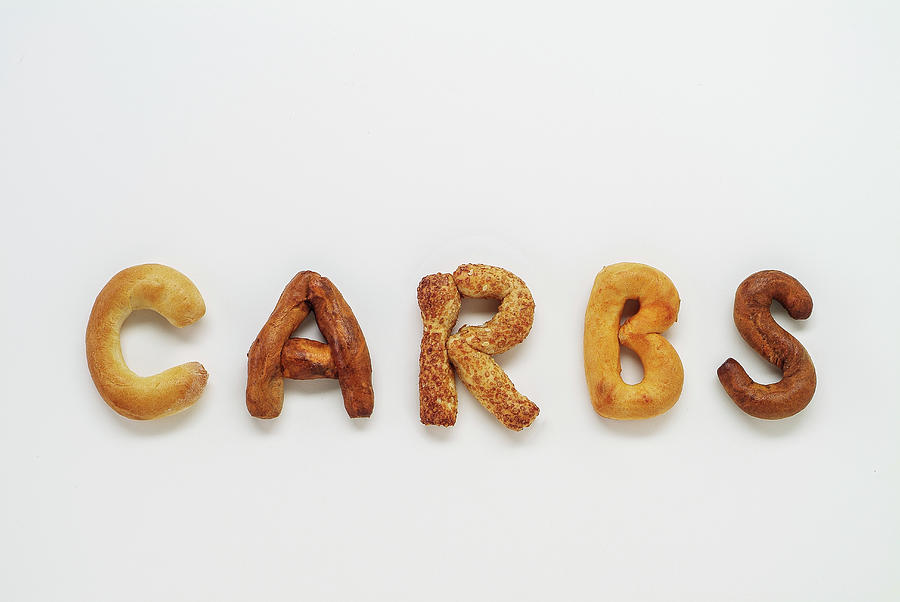 Carbs Spelled Out With Bread Basket Goodies Photograph by Golden Goose Productions