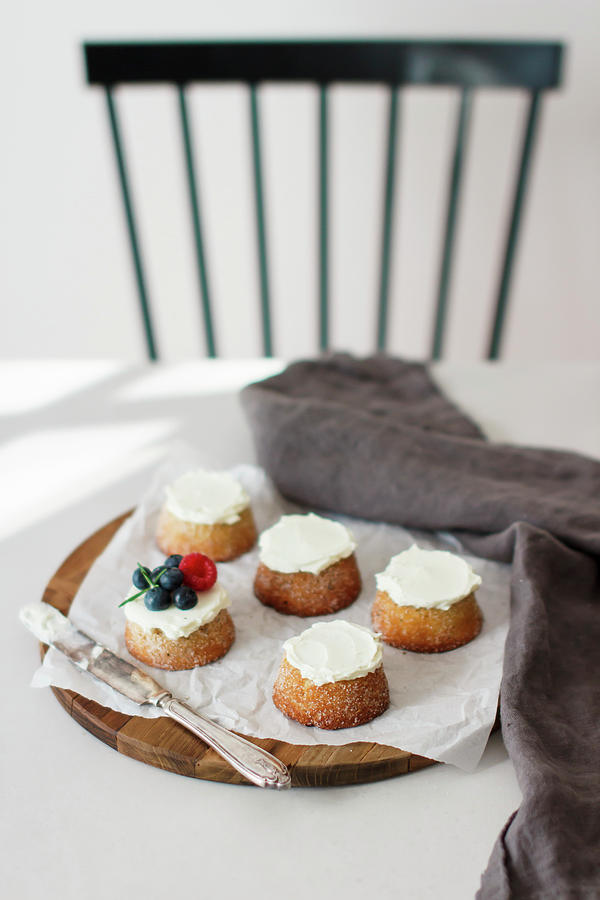 Cardamom And Marzipan Cakes Topped With Cream And Berries Photograph by Annalena Bokmeier
