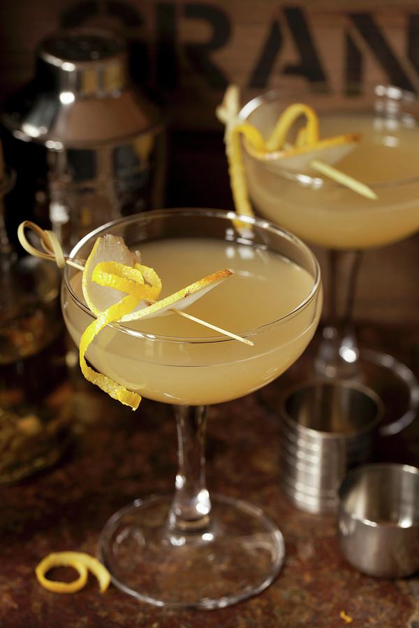 Cardamom Spiced Pear Martini With Pear And Lemon Garnish Photograph by Jane Saunders