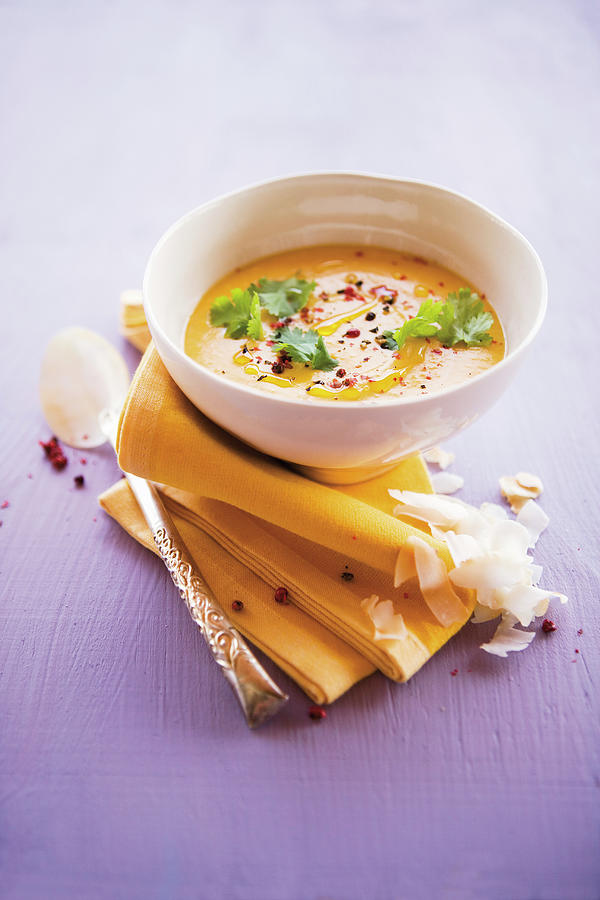 Caribbean Pumpkin And Coconut Soup With Coriander Photograph by Michael Wissing