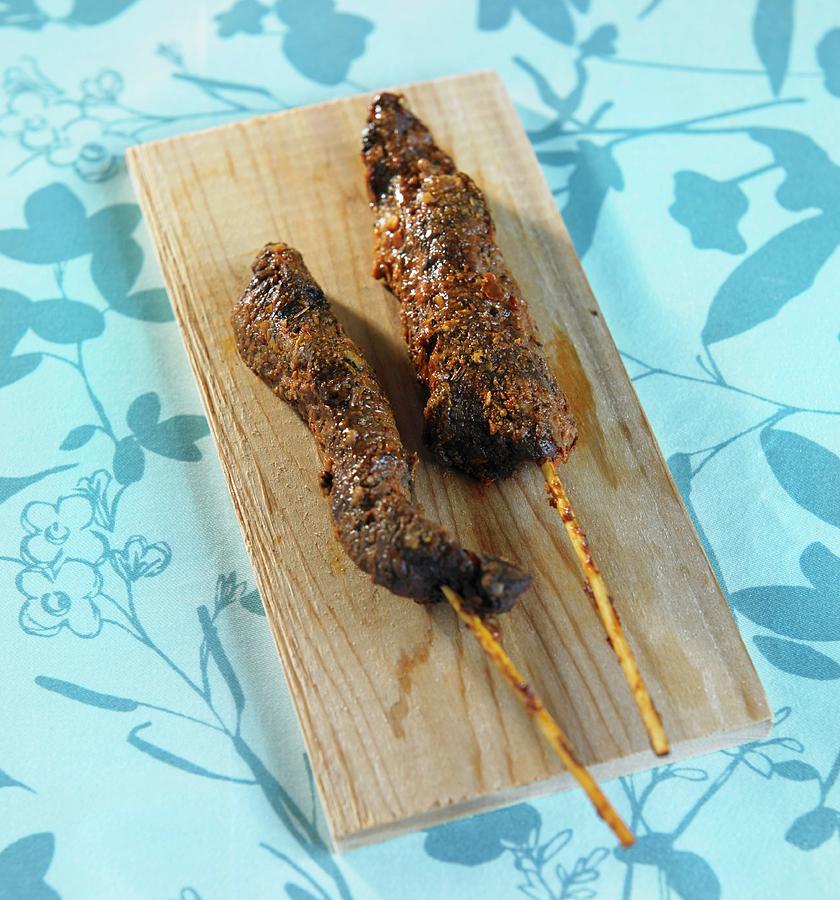 Carne Asada Skewers On A Wooden Board Photograph by Allison Dinner