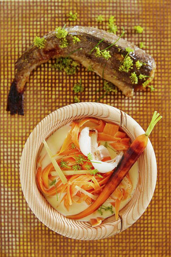 Carrot And Coconut Soup With Fried Fennel Hake Photograph by Great Stock!
