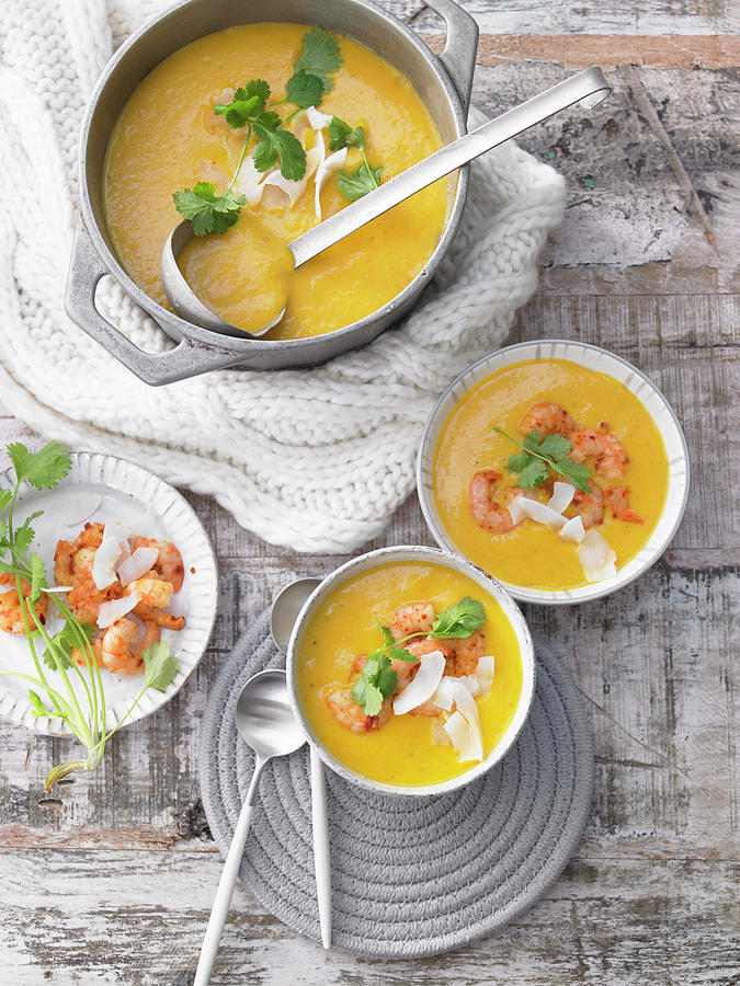 Carrot And Coconut Soup With Shrimp Photograph by Jan-peter Westermann