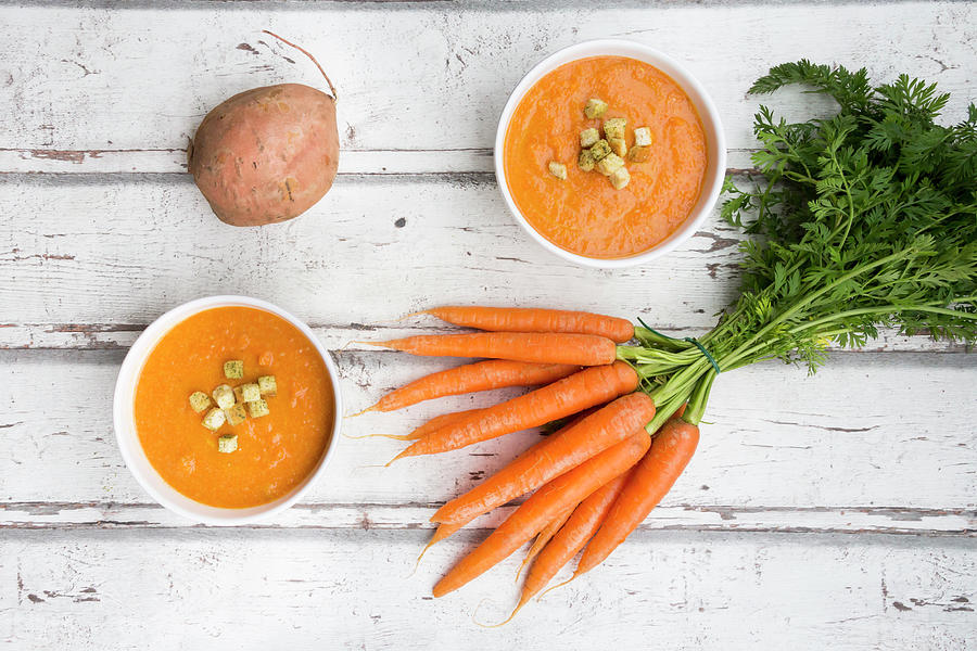 Carrot And Sweet Potato Soup With Croutons Photograph by Larissa Veronesi