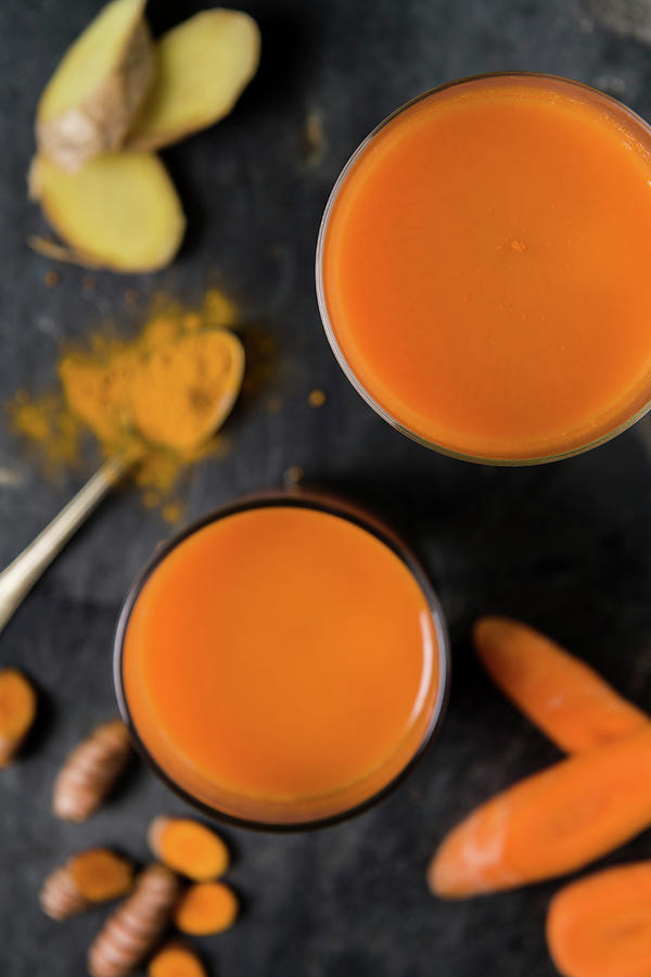 Carrot And Turmeric Juice With Ginger Photograph by Komar