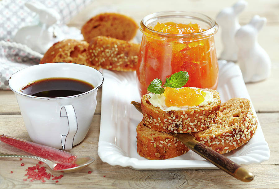 Carrot, Apple And Ginger Preserve For An Easter Brunch Served With Wholemeal Baguette And A Cup Of Coffee Photograph by Teubner Foodfoto