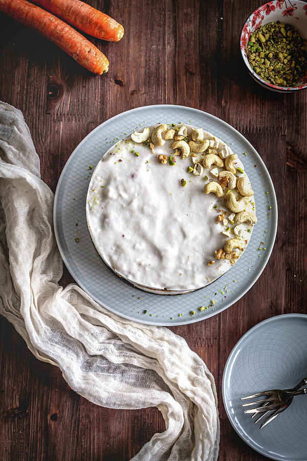 Carrot Cake With Icing And Pistachio-cashew Decorations Photograph by Daniela Lambova