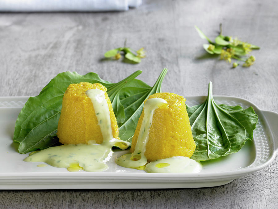 Carrot Flans With Wild Herbs And Sour Cream Sauce Photograph by Barbara Lutterbeck