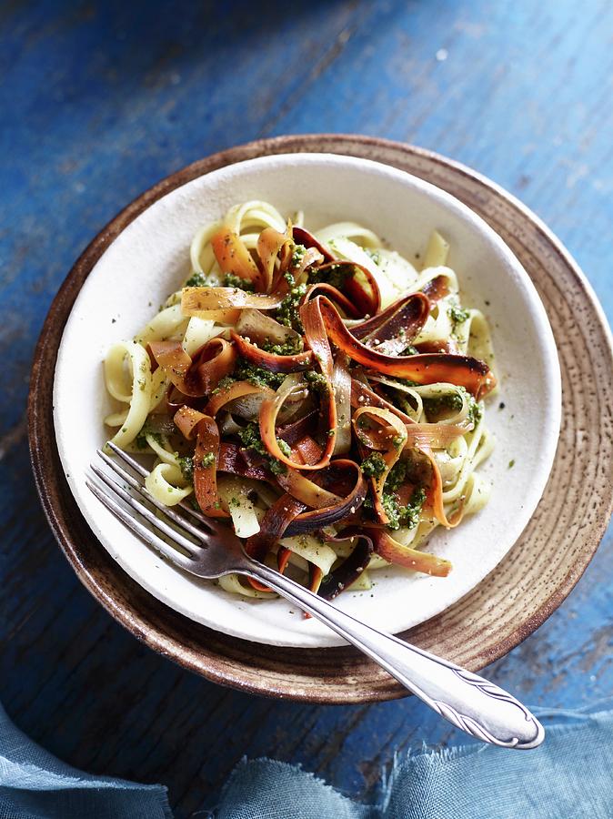 Carrot Noodles With Basil And Walnut Pesto Photograph by Oliver Brachat