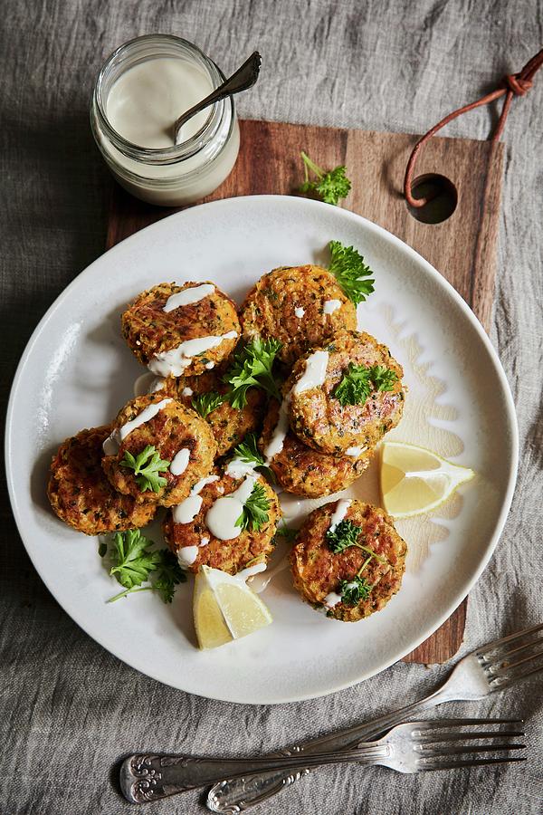 Carrot Patties With Ginger, Herbs And Drizzled Lemon Tahini Dressing Photograph by Fanny Rdvik