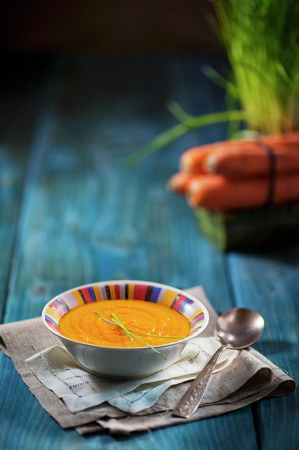 Carrot Soup With Chives Photograph by Jan Prerovsky
