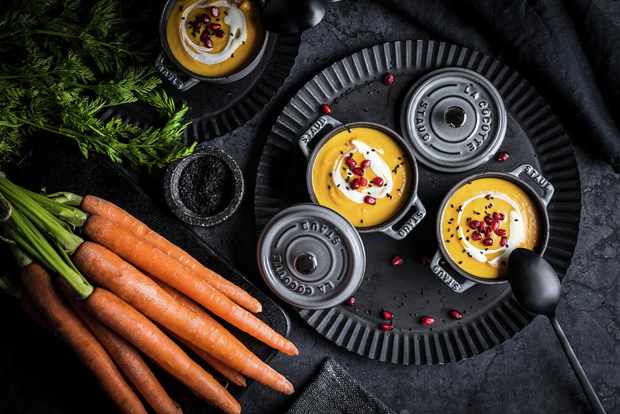 Carrot Soup With Pomegranate Seeds In Cocotte Ramekins morocco Photograph by Christian Kutschka