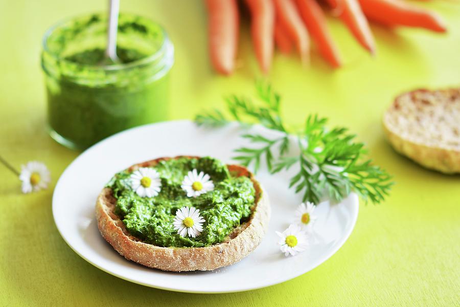 Carrot Top Pesto Spread On Bread, Decorated With Daisies Photograph by Mariola Streim