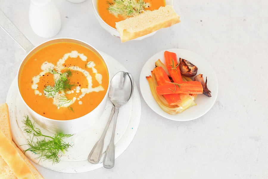 Carrots And Fennel Roasted Soup Served With Focaccia Photograph by Claudia Gargioni