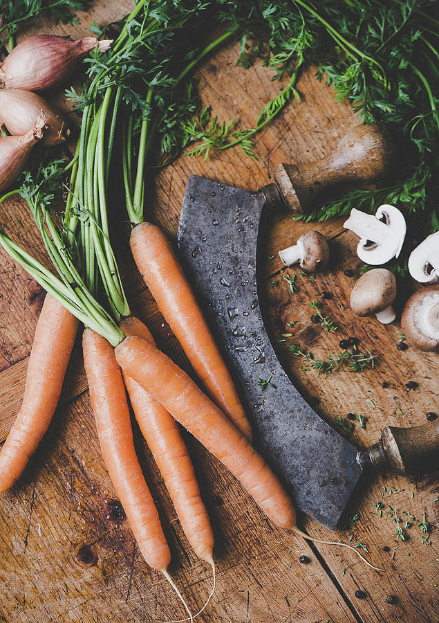 Carrots, Onions, Mushrooms And A Chopping Knife Photograph by Ewgenija Schall