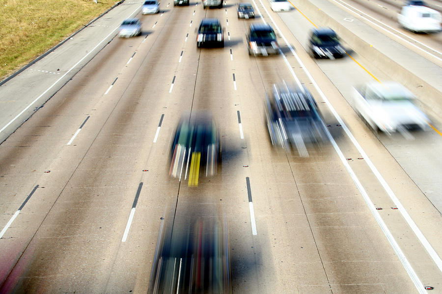 Cars In Motion Driving Down A Freeway Photograph by Steve Debenport