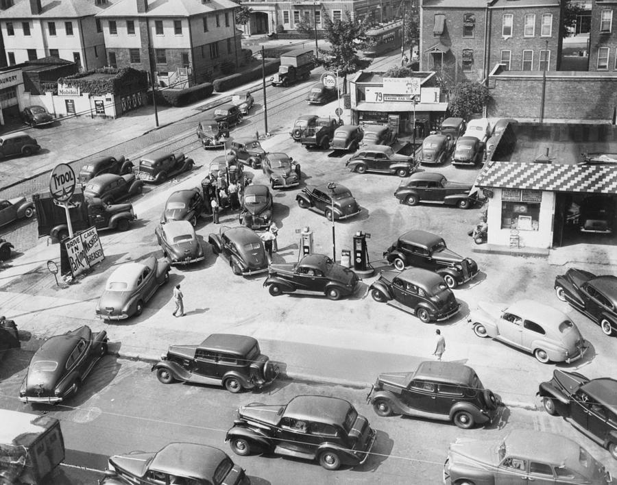 Cars Surround One Gas Pump Photograph by Bettmann