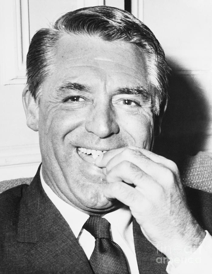 Cary Grant Taking A Pill Photograph by Bettmann