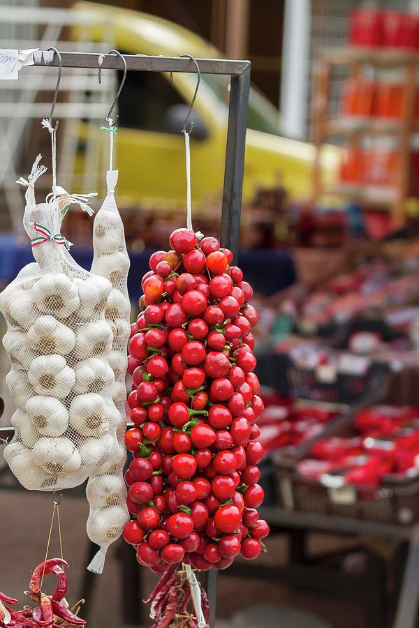 Cascabel Chillis And Garlic On A Market Stand Photograph by Adel Bekefi