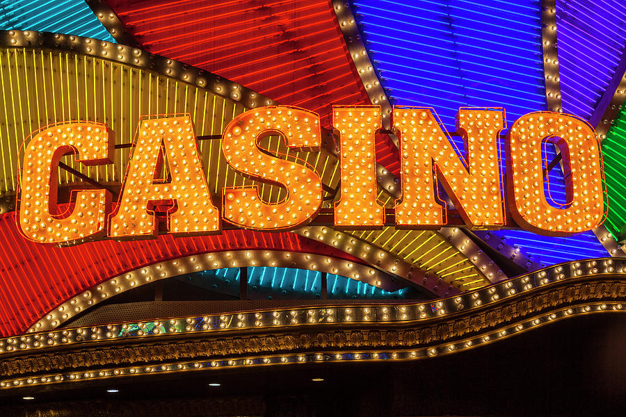 Casino Sign In Neon Photograph by Stuart Dee