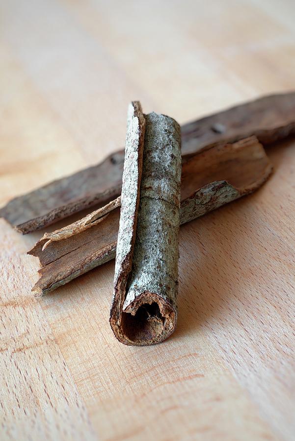 Cassia Cinnamon Bark On A Wooden Table Photograph by Dr. Martin Baumgrtner