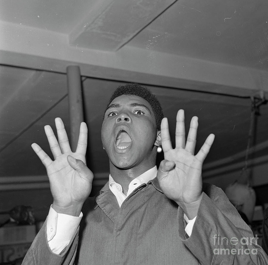 Cassius Clay Holding Up Eight Fingers Photograph by Bettmann