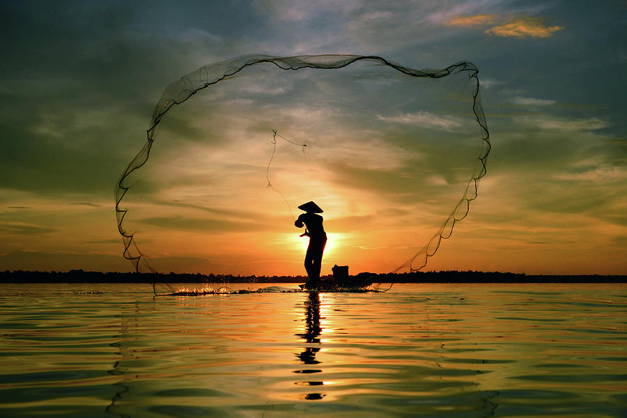 Cast Fishing Photograph by Sarawut
