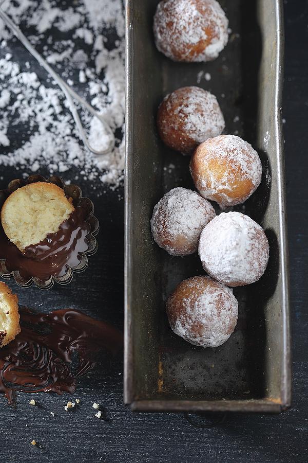 Castagnole deep Fried Pastries, Italy With Icing Sugar And Melted Chocolate Photograph by Zita Csig