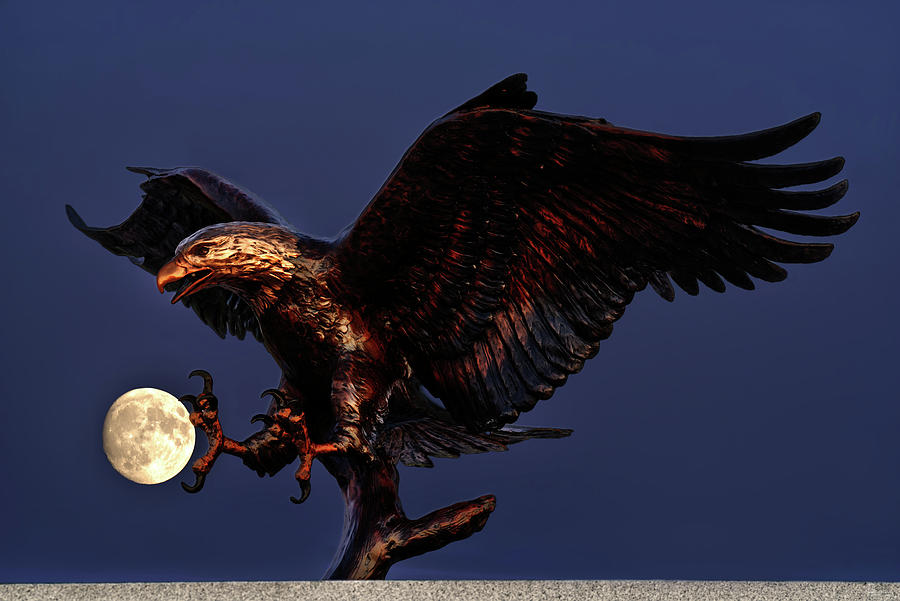 Catching the Moon - cast bronze eagle at Stoughton Veterans Memorial site aligned with full moon Photograph by Peter Herman