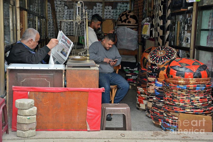 Bazaar Photograph - Catching the News by Andrea Simon