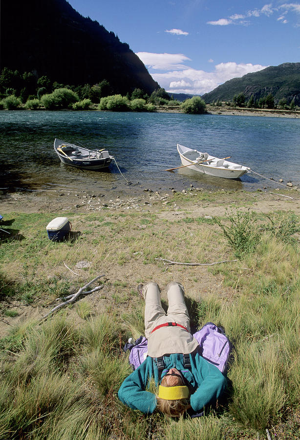 Summer Photograph - Cathy Beck Relaxing After Fly Fishing On The Futaleufu River  In Chile by Cavan Images