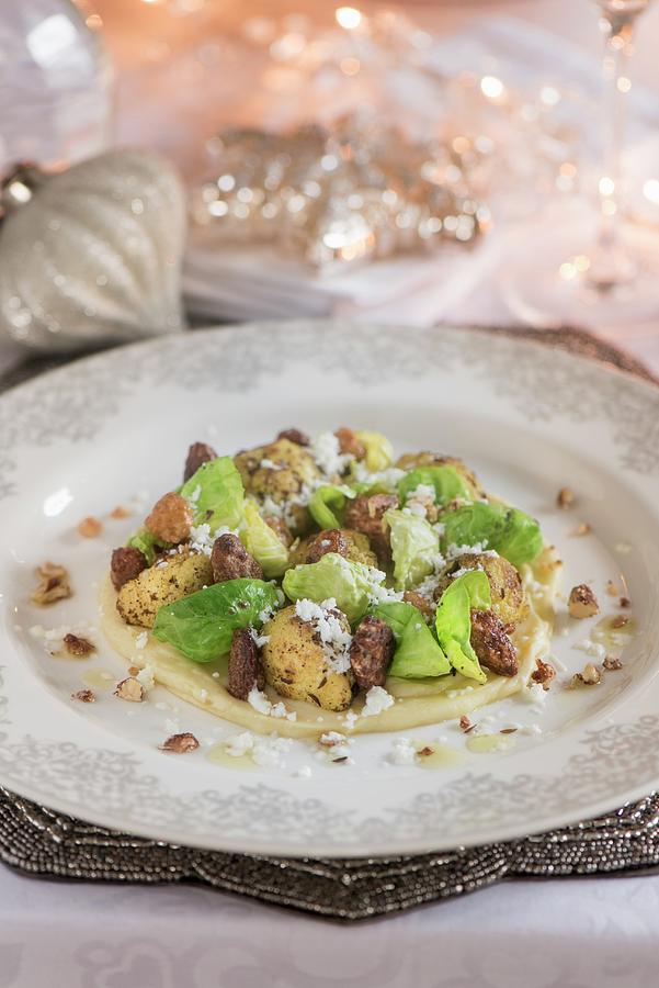 Cauliflower And Brussel Sprout Leaves On A Bed Of Mashed Potato, Caraway And Goats Cheese Photograph by Winfried Heinze