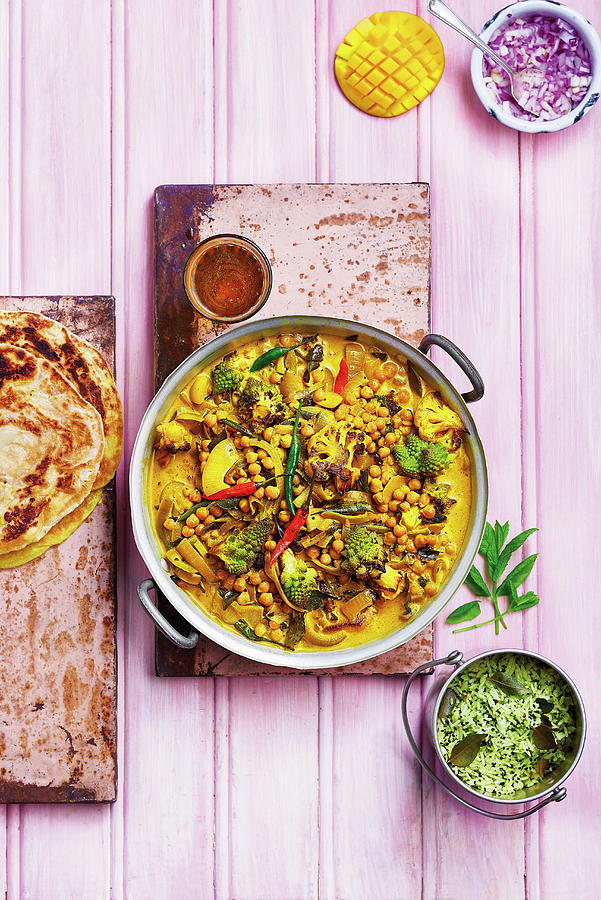 Cauliflower And Romanesco Cauliflower Curry With Chickpeas, Chilli, Onions, Served With Rice, Breads, Mango And Raw Onion Photograph by Cliqq Photography