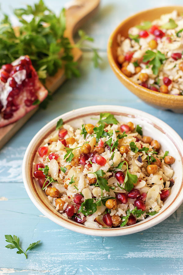 Cauliflower Cous Cous With Chickpeas, Pomegranate, Almond Flakes And Parsley Photograph by Zuzanna Ploch