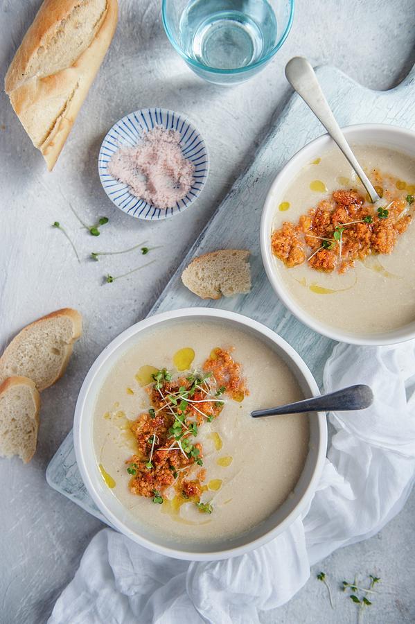 Cauliflower Cream Soup With Chorizo ??and Olive Oil, Next To A Piece Of Bread Photograph by Magdalena Hendey