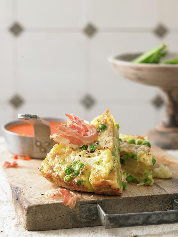 Cauliflower Frittata With Wild Flower Cheese And Bacon Chips On A Red Pepper Sauce Photograph by Jan-peter Westermann